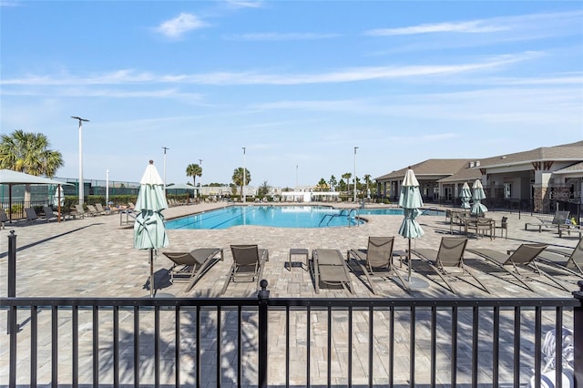 10298 SW 96th Loop, Ocala, FL 34481 - community pool featuring a patio area