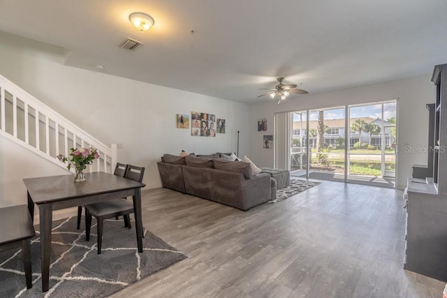 15958 Marcello Cir, Naples, FL 34110 - living room with ceiling fan, wood finished floors, and stairs