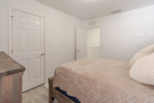 15958 Marcello Cir, Naples, FL 34110 - bedroom featuring light wood-style flooring