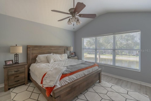 15958 Marcello Cir, Naples, FL 34110 - bedroom with lofted ceiling, light wood-style flooring, baseboards, and ceiling fan