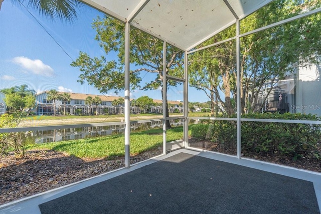 15958 Marcello Cir, Naples, FL 34110 - unfurnished sunroom with a water view, lofted ceiling, and a residential view