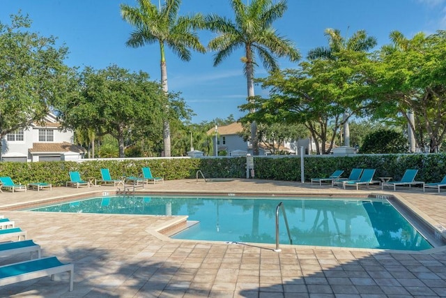 15958 Marcello Cir, Naples, FL 34110 - community pool with a patio area