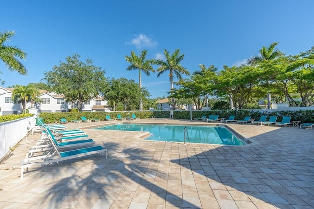 15958 Marcello Cir, Naples, FL 34110 - community pool featuring a patio area