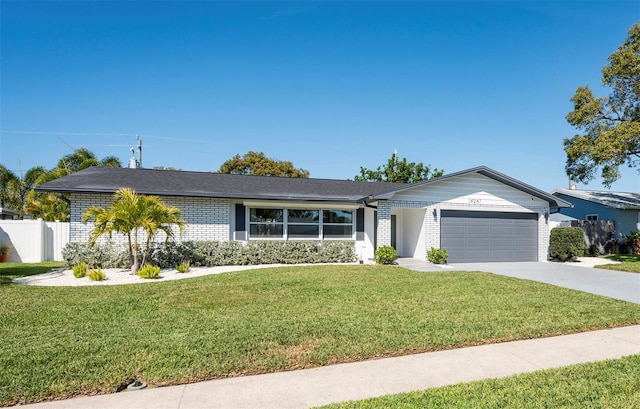 14261 113th Ave, Largo, FL 33774 - single story home featuring brick siding, an attached garage, and driveway