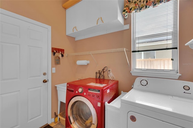 2015 Long Branch Ln, Clearwater, FL 33760 - laundry area featuring cabinet space, washer and dryer, and healthy amount of natural light