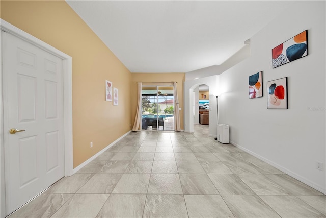603 Loma Del Sol Dr, Davenport, FL 33896 - empty room featuring arched walkways and baseboards