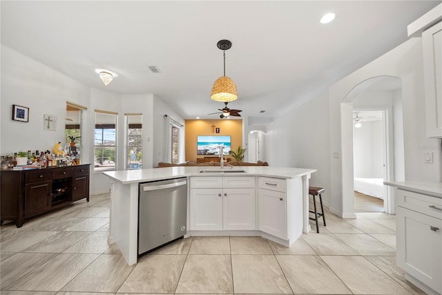 603 Loma Del Sol Dr, Davenport, FL 33896 - kitchen with ceiling fan, dishwasher, arched walkways, light countertops, and recessed lighting