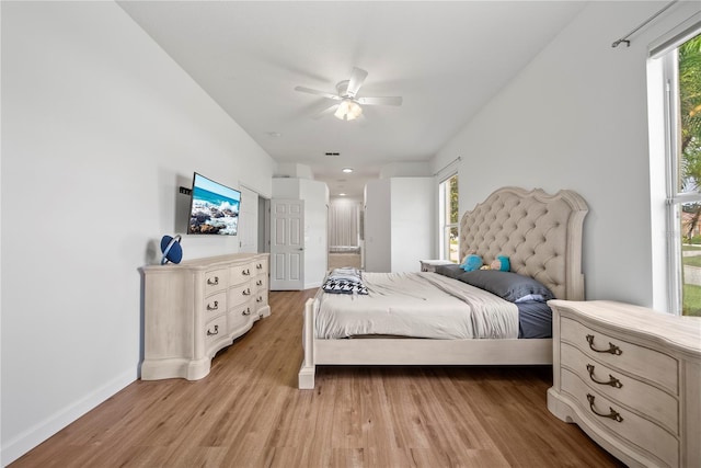 603 Loma Del Sol Dr, Davenport, FL 33896 - bedroom with light wood-type flooring and ceiling fan