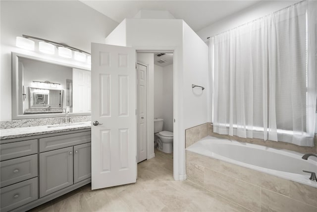 603 Loma Del Sol Dr, Davenport, FL 33896 - full bathroom with a garden tub and vanity