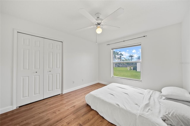 603 Loma Del Sol Dr, Davenport, FL 33896 - bedroom featuring wood finished floors, a closet, and ceiling fan