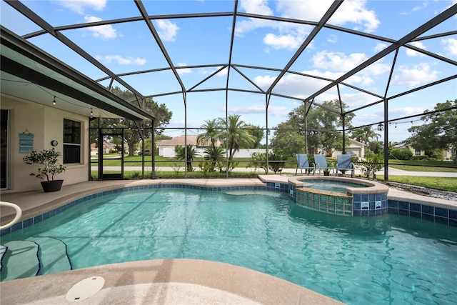 603 Loma Del Sol Dr, Davenport, FL 33896 - view of swimming pool featuring a pool with connected hot tub, glass enclosure, and a patio