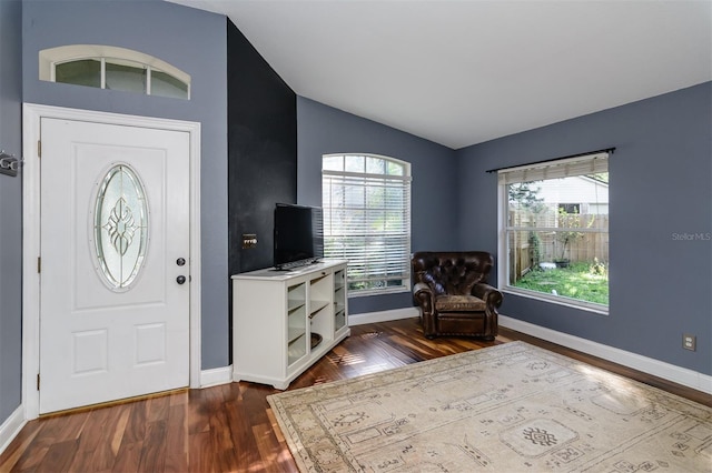 5619 Essex Ct, Palm Harbor, FL 34685 - foyer featuring lofted ceiling, dark wood finished floors, and baseboards