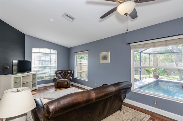 5619 Essex Ct, Palm Harbor, FL 34685 - living area featuring lofted ceiling, wood finished floors, baseboards, and ceiling fan