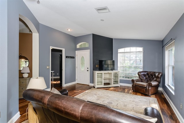 5619 Essex Ct, Palm Harbor, FL 34685 - living room with wood finished floors, baseboards, and vaulted ceiling