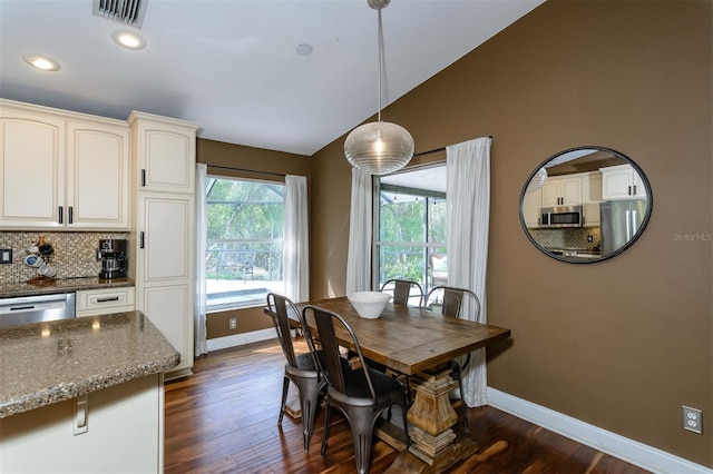 5619 Essex Ct, Palm Harbor, FL 34685 - dining area with baseboards, lofted ceiling, dark wood-style floors, and recessed lighting