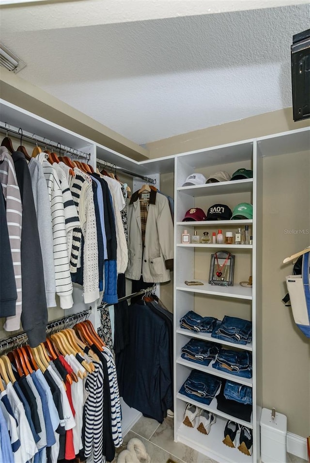 5619 Essex Ct, Palm Harbor, FL 34685 - walk in closet with tile patterned floors
