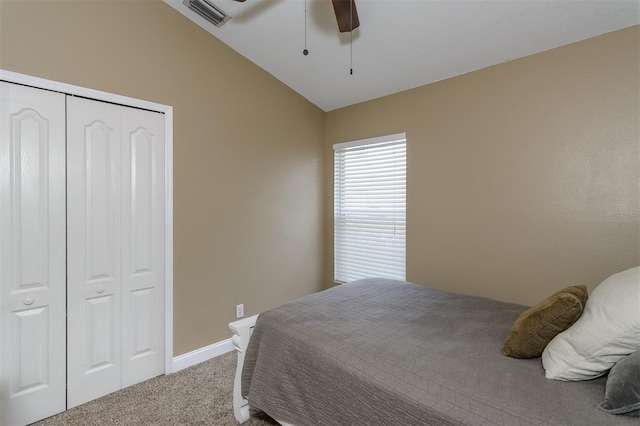 5619 Essex Ct, Palm Harbor, FL 34685 - carpeted bedroom featuring a closet, baseboards, lofted ceiling, and a ceiling fan
