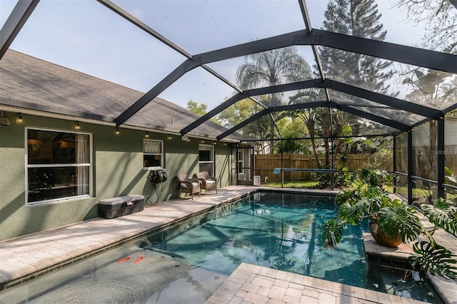 5619 Essex Ct, Palm Harbor, FL 34685 - view of swimming pool featuring a fenced backyard, glass enclosure, and a patio area