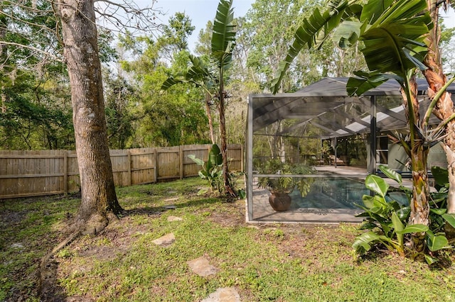 5619 Essex Ct, Palm Harbor, FL 34685 - fenced backyard featuring a lanai
