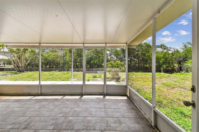 1110 Canal St, Ruskin, FL 33570 - unfurnished sunroom with view of scattered trees