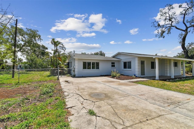 1110 Canal St, Ruskin, FL 33570 - view of front of property with concrete driveway, stucco siding, and covered porch