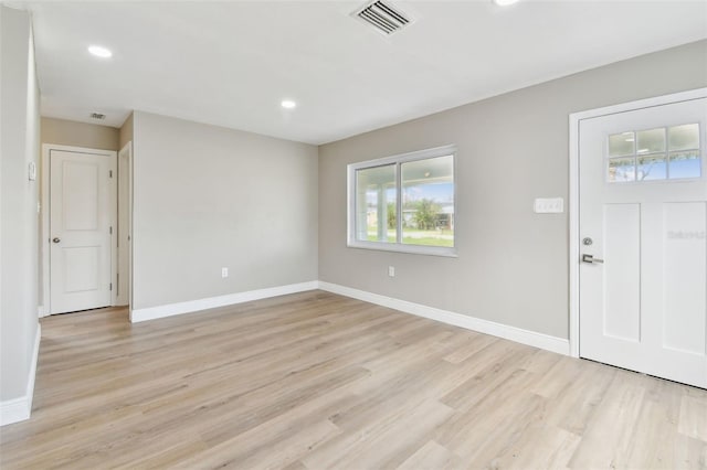 1110 Canal St, Ruskin, FL 33570 - entrance foyer with light wood finished floors, baseboards, and recessed lighting