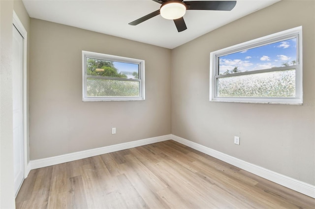 1110 Canal St, Ruskin, FL 33570 - spare room featuring wood finished floors, baseboards, and ceiling fan