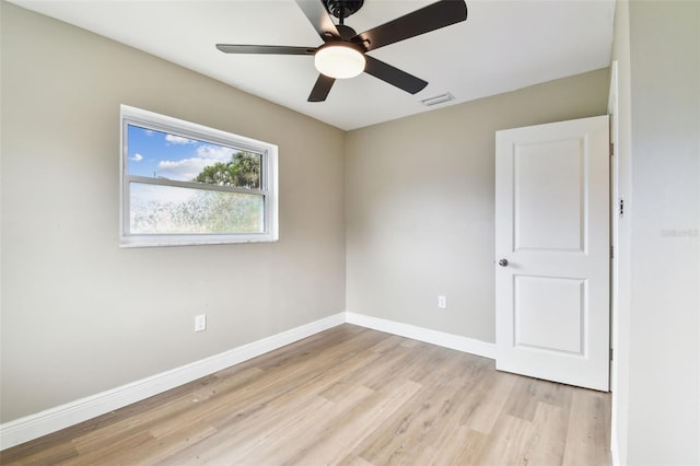 1110 Canal St, Ruskin, FL 33570 - unfurnished room featuring light wood finished floors, a ceiling fan, and baseboards