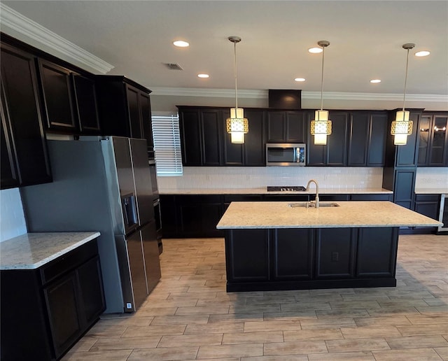 1521 Sourwood Dr, Ocoee, FL 34761 - kitchen featuring appliances with stainless steel finishes, a sink, ornamental molding, decorative backsplash, and light stone counters