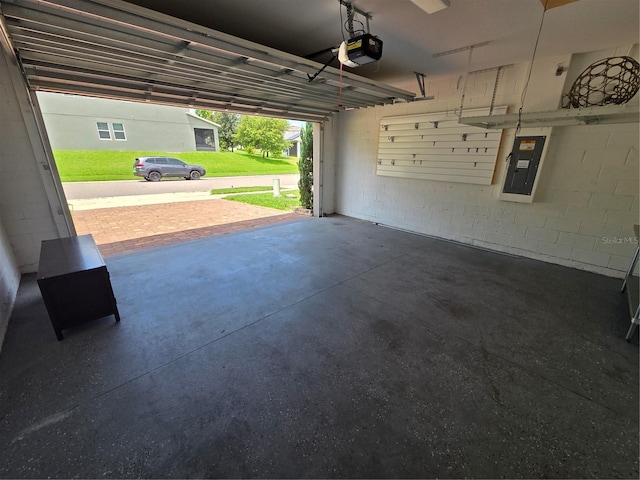 1521 Sourwood Dr, Ocoee, FL 34761 - garage featuring electric panel, a garage door opener, and concrete block wall