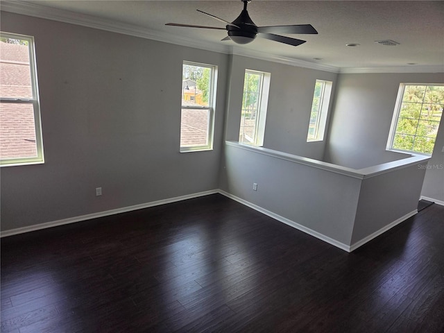 1521 Sourwood Dr, Ocoee, FL 34761 - unfurnished room featuring crown molding, dark wood-style flooring, healthy amount of natural light, a ceiling fan, and baseboards