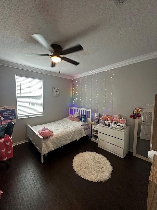 1521 Sourwood Dr, Ocoee, FL 34761 - bedroom with crown molding, hardwood / wood-style flooring, a textured ceiling, ceiling fan, and baseboards