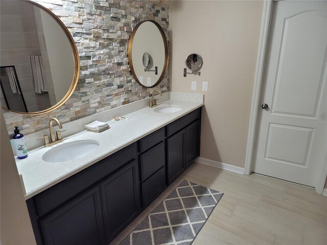 1521 Sourwood Dr, Ocoee, FL 34761 - bathroom with decorative backsplash, double vanity, and baseboards