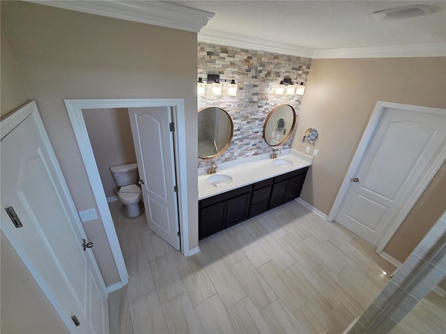 1521 Sourwood Dr, Ocoee, FL 34761 - full bathroom featuring toilet, double vanity, ornamental molding, and baseboards