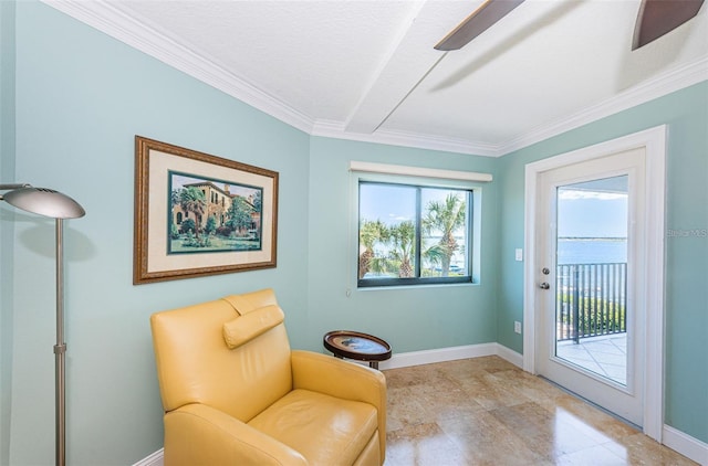 240 Sand Key Estates Dr Unit 222, Clearwater, FL 33767 - living area featuring ornamental molding and baseboards