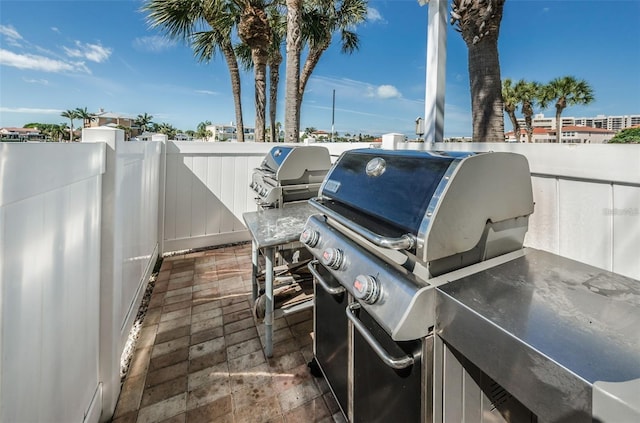240 Sand Key Estates Dr Unit 222, Clearwater, FL 33767 - view of patio / terrace featuring grilling area