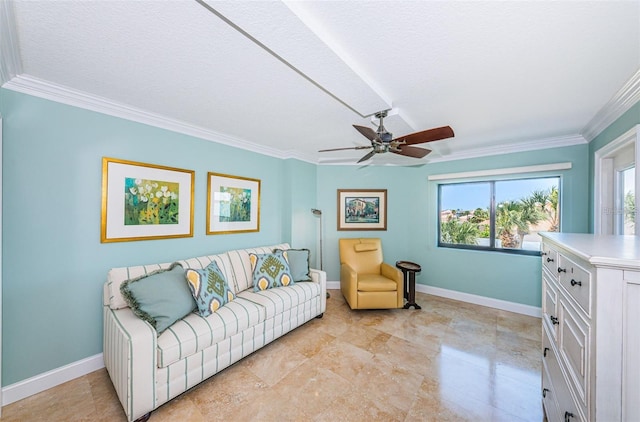 240 Sand Key Estates Dr Unit 222, Clearwater, FL 33767 - living area with crown molding, healthy amount of natural light, baseboards, a ceiling fan, and a textured ceiling