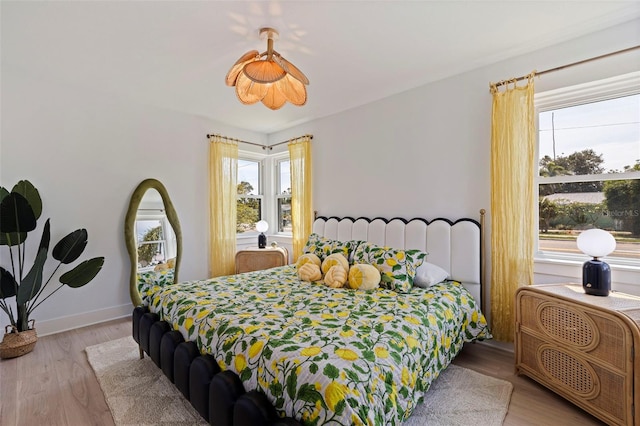 1579 Bayshore Blvd, Dunedin, FL 34698 - bedroom with multiple windows and light wood-type flooring