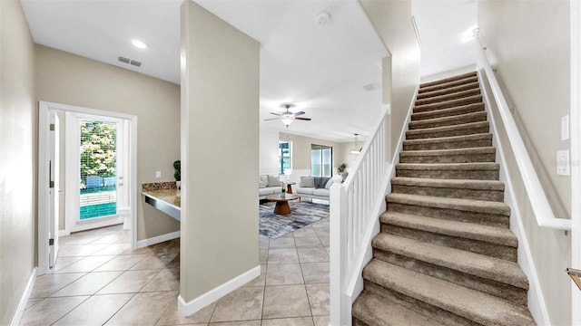 13903 Sage Thrasher Ln, Riverview, FL 33579 - stairs featuring ceiling fan and tile patterned flooring
