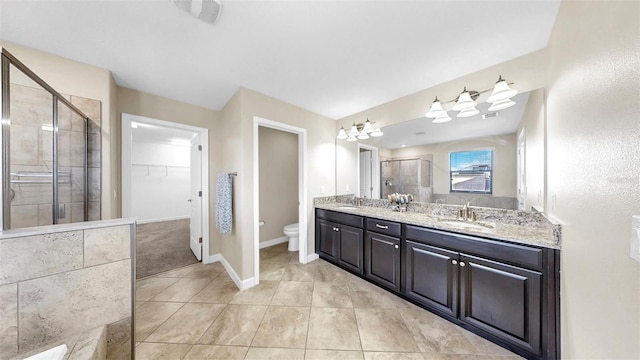 13903 Sage Thrasher Ln, Riverview, FL 33579 - full bath featuring a stall shower, double vanity, a spacious closet, and tile patterned floors