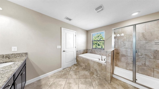 13903 Sage Thrasher Ln, Riverview, FL 33579 - full bathroom with a garden tub, vanity, a stall shower, and tile patterned flooring