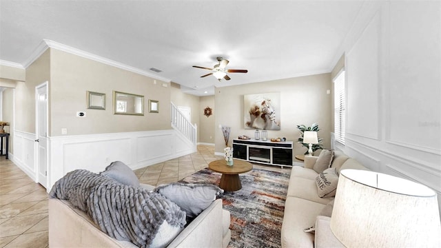 13903 Sage Thrasher Ln, Riverview, FL 33579 - living room with stairway, light tile patterned flooring, ceiling fan, and ornamental molding