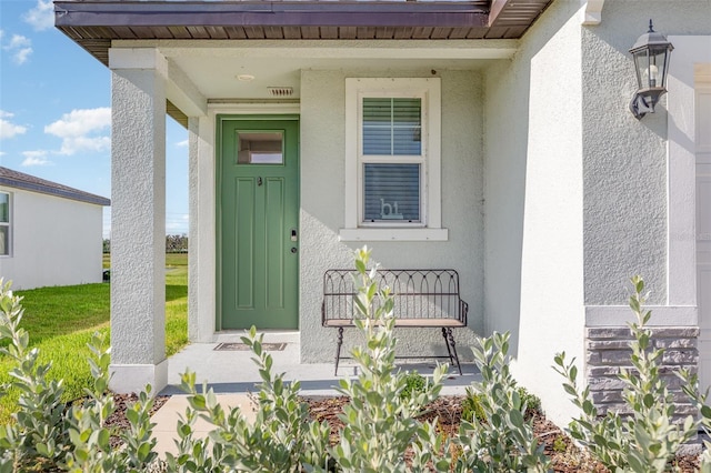 13958 Richland Gulf Cir, Parrish, FL 34219 - entrance to property featuring stucco siding and covered porch