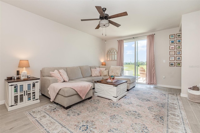 13958 Richland Gulf Cir, Parrish, FL 34219 - living room with a ceiling fan, baseboards, and wood finished floors