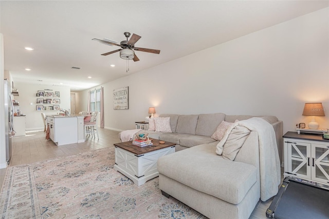 13958 Richland Gulf Cir, Parrish, FL 34219 - living area with ceiling fan, recessed lighting, and baseboards