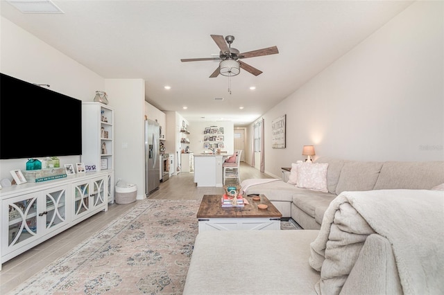 13958 Richland Gulf Cir, Parrish, FL 34219 - living area featuring a ceiling fan, recessed lighting, and light wood-type flooring