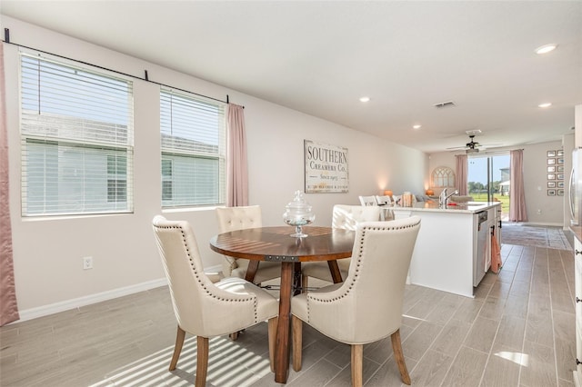 13958 Richland Gulf Cir, Parrish, FL 34219 - dining area with light wood-style flooring, baseboards, recessed lighting, and ceiling fan