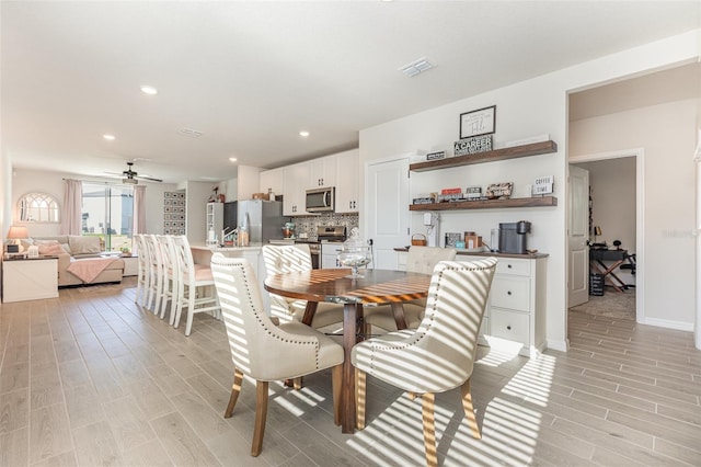 13958 Richland Gulf Cir, Parrish, FL 34219 - dining space with ceiling fan, light wood finished floors, recessed lighting, and baseboards
