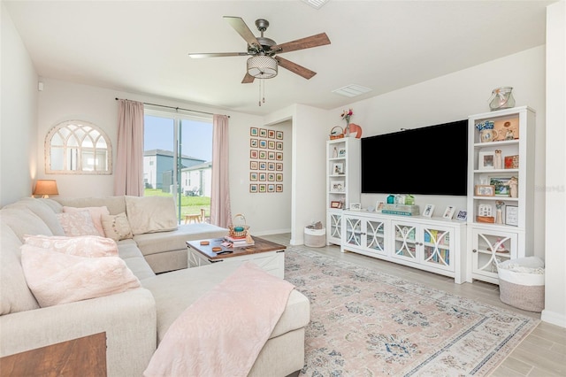 13958 Richland Gulf Cir, Parrish, FL 34219 - living area with a ceiling fan, baseboards, and wood finished floors