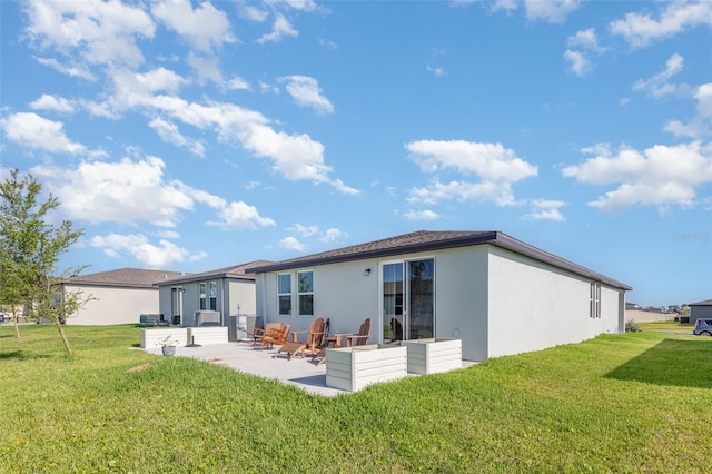 13958 Richland Gulf Cir, Parrish, FL 34219 - rear view of house with stucco siding, a patio, and a yard